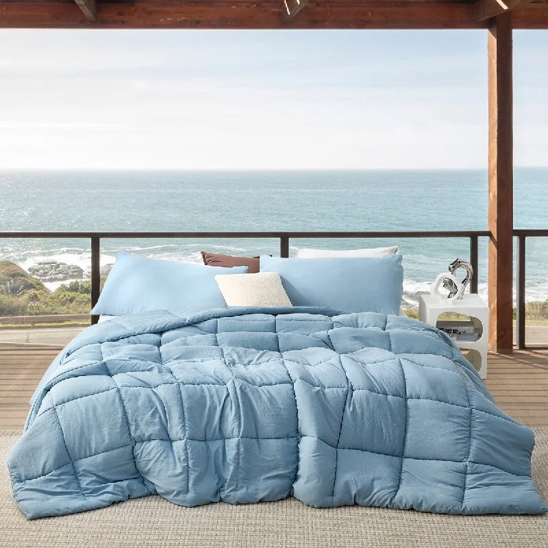 Goose down comforters known for their superior quality and insulationBeachfront Avenue - Coma Inducer® Oversized Cooling Comforter Set - Smoke Blue