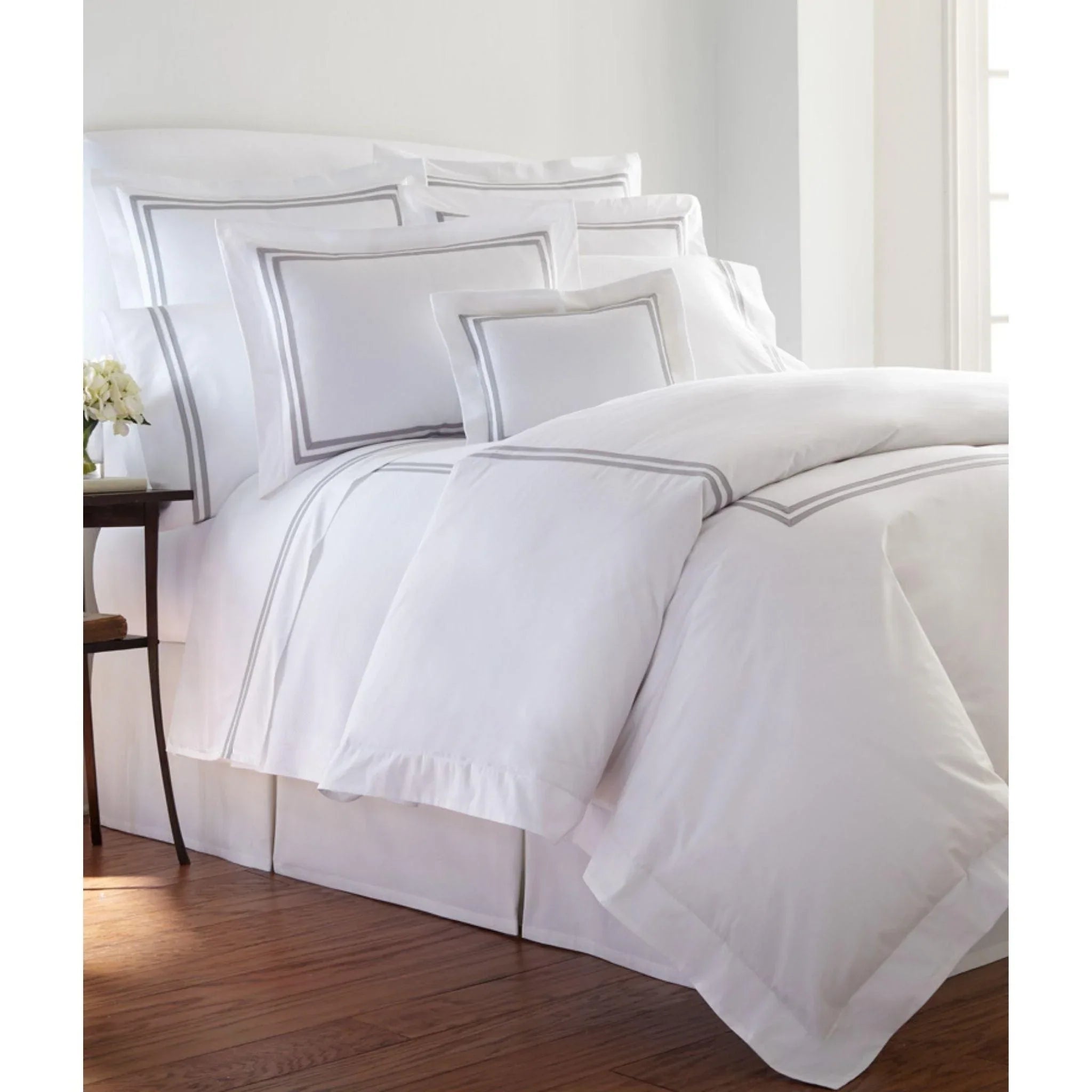 Oversized duvet covers that drape beautifully over the sides of the bed for a luxurious lookBrendon Two Bands Tape Trimmed Duvet