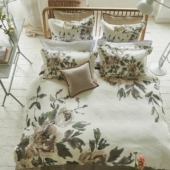 Patchwork duvet covers with a variety of fabric pieces sewn together for a rustic charmDesigners Guild Shanghai Garden Ecru Bedding