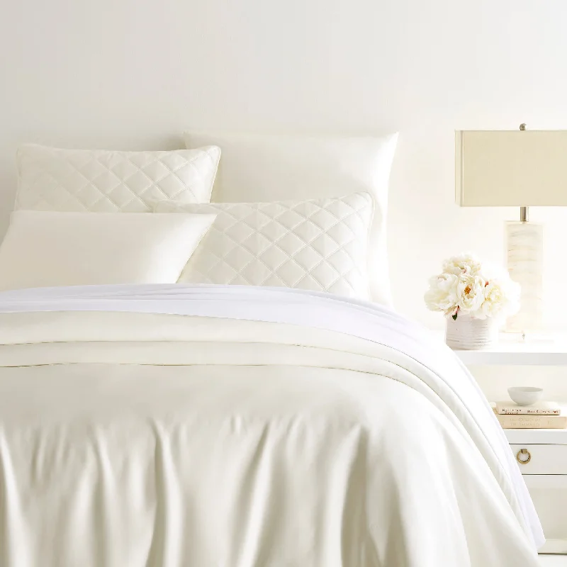 Oversized duvet covers that drape beautifully over the sides of the bed for a luxurious lookSilken Solid Ivory Duvet Cover